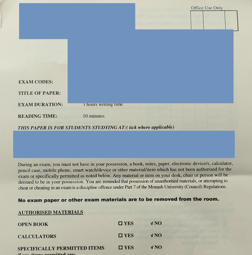 A photograph of a printed Monash University exam cover sheet. The exam code, title and study-location fields are covered by blue blocks. Visible: three hours writing time, ten minutes reading time, an Office Use Only box, the standard warning against unauthorised materials, a line reading no exam paper or other exam materials are to be removed from the room, and an authorised materials section where open book, calculators and specifically permitted items are all marked no.